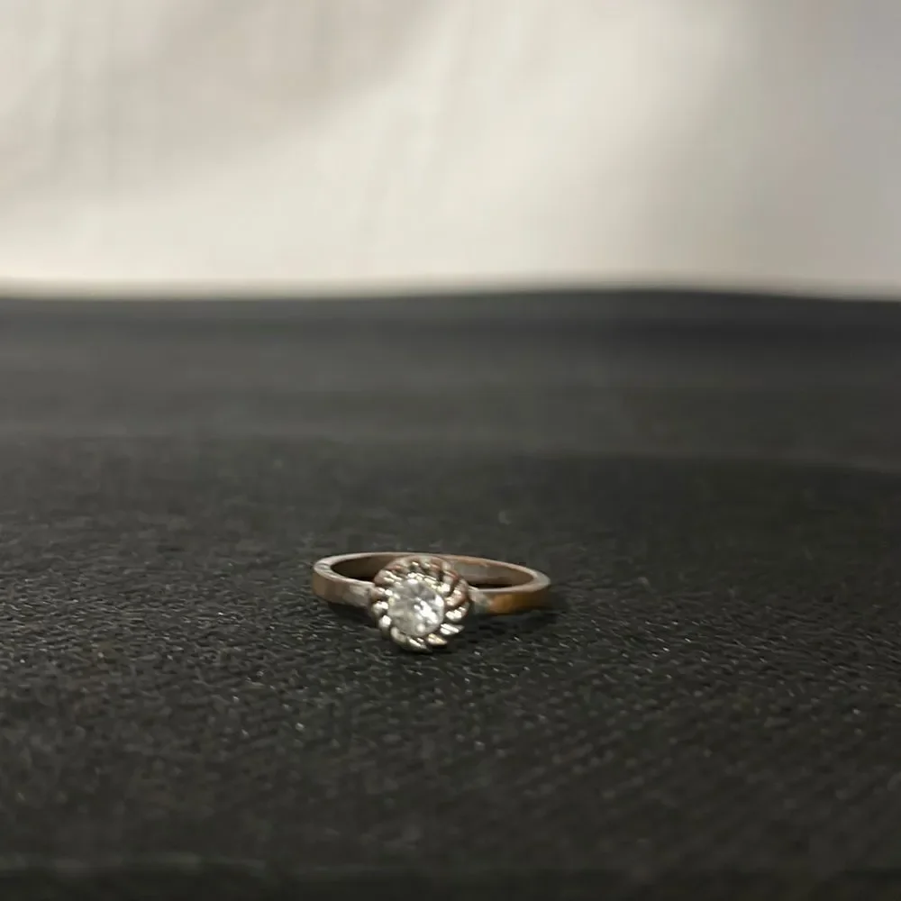 Small ring with a white gem